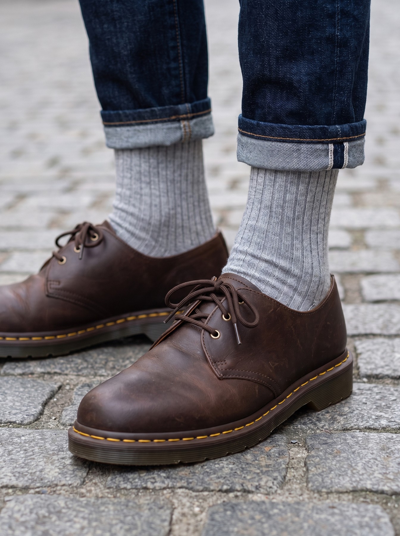 Grey socks styled with brown leather shoes