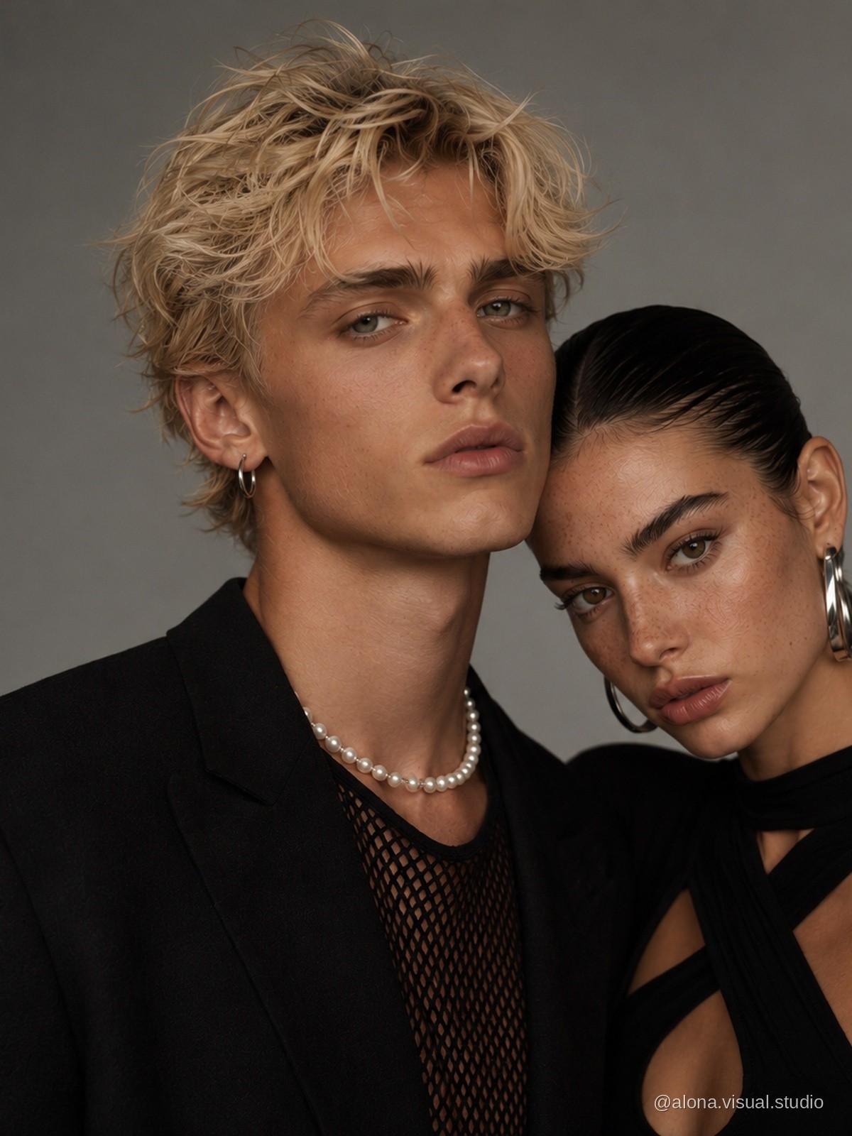 Fashion couple in black tailoring, close portrait