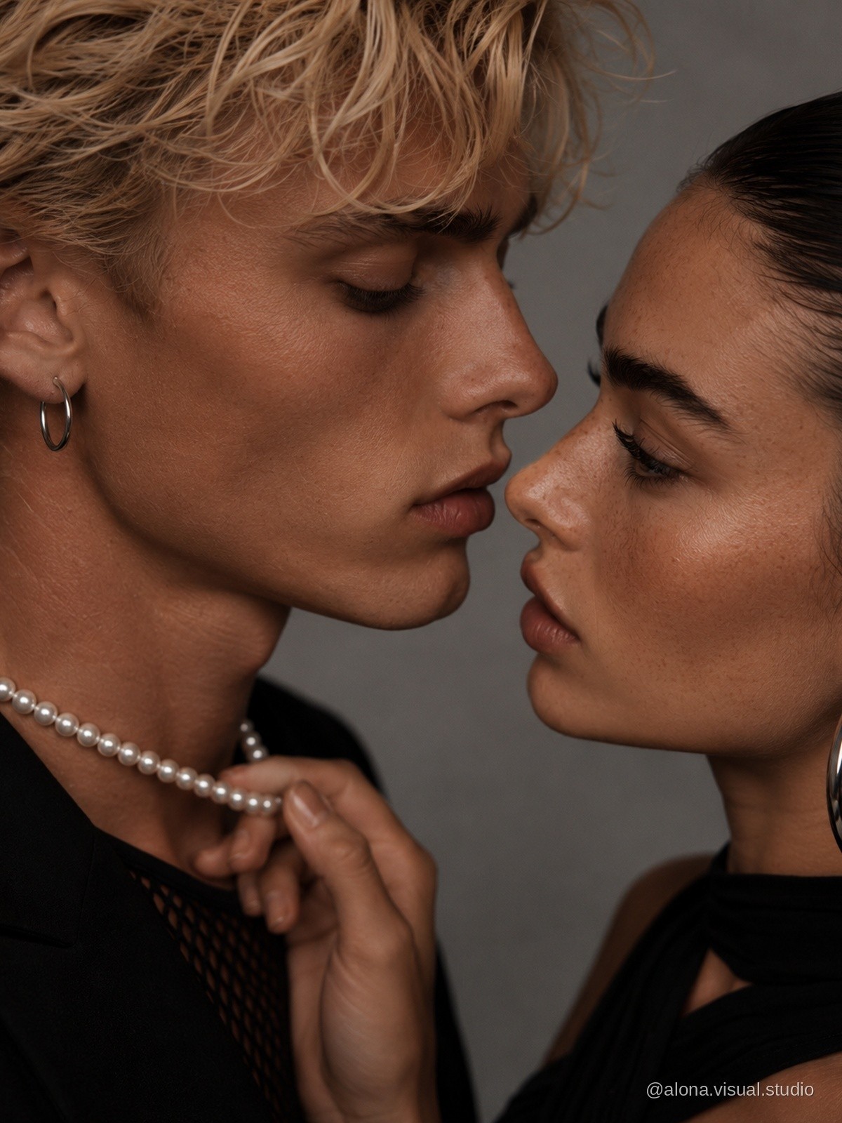 Close fashion portrait with a pearl necklace